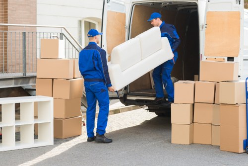 Professional moving team handling furniture for removals in Arnosgrove