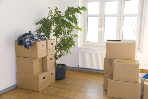Furniture and boxed items prepared for a small removal service