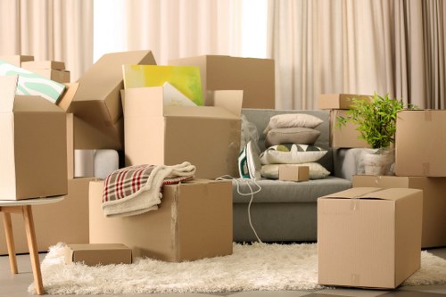 Furniture being carried through a flat staircase with care